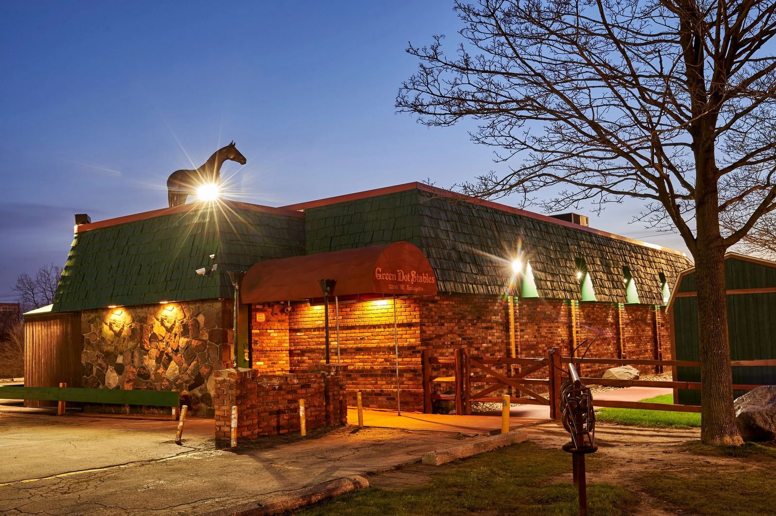 Green Dot Stables exterior at night