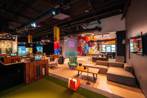 Five Iron Golf Detroit – Shelby Township: Five Iron Golf Shelby Township interior with simulator bays