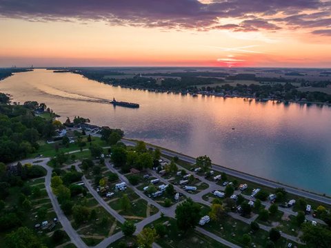 Sunset over the river and campground from the air