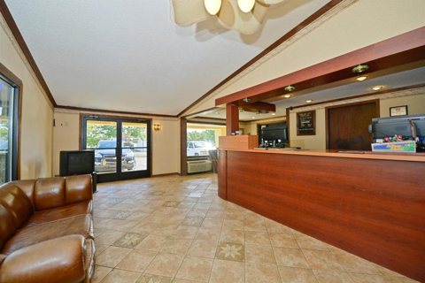 The front desk and leather sofas in the lobby