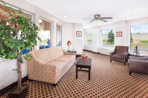 A room with a sofa seating area