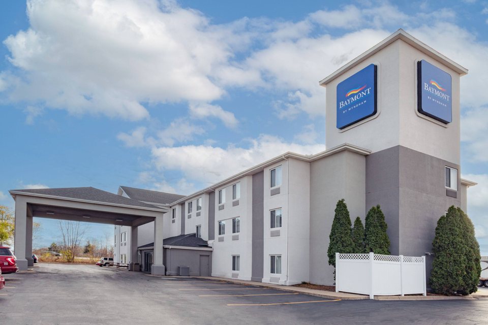 The hotel with its blue sign on the building corner