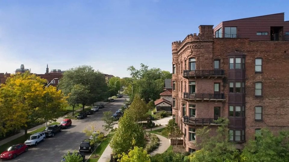 The El Moore brick building with its corner turret and balconies on Alexandrine Street