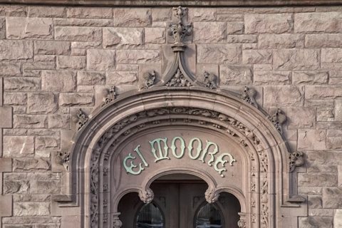 The carved stone entrance arch with the El Moore lettering
