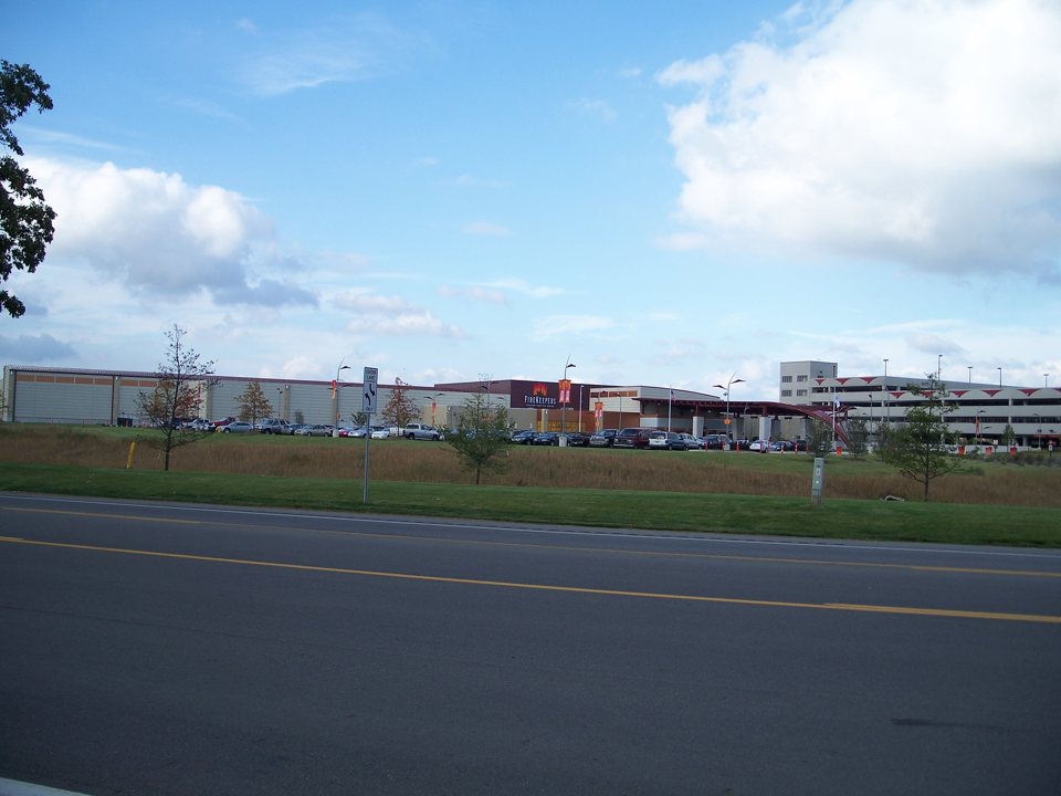 The FireKeepers casino building and parking lot seen from the road in 2009