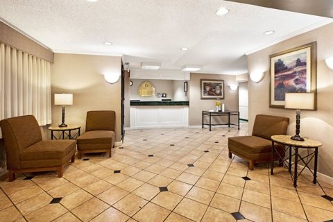 The lobby with armchairs and a tiled floor
