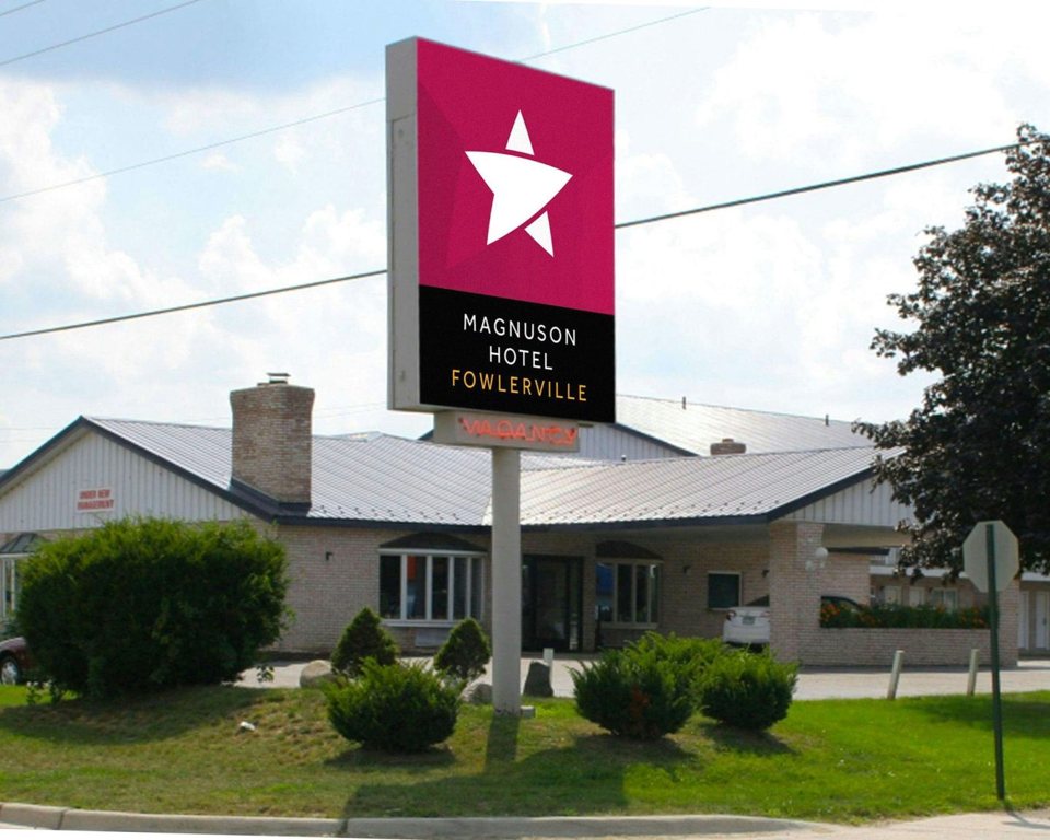 The hotel's roadside sign in front of the building