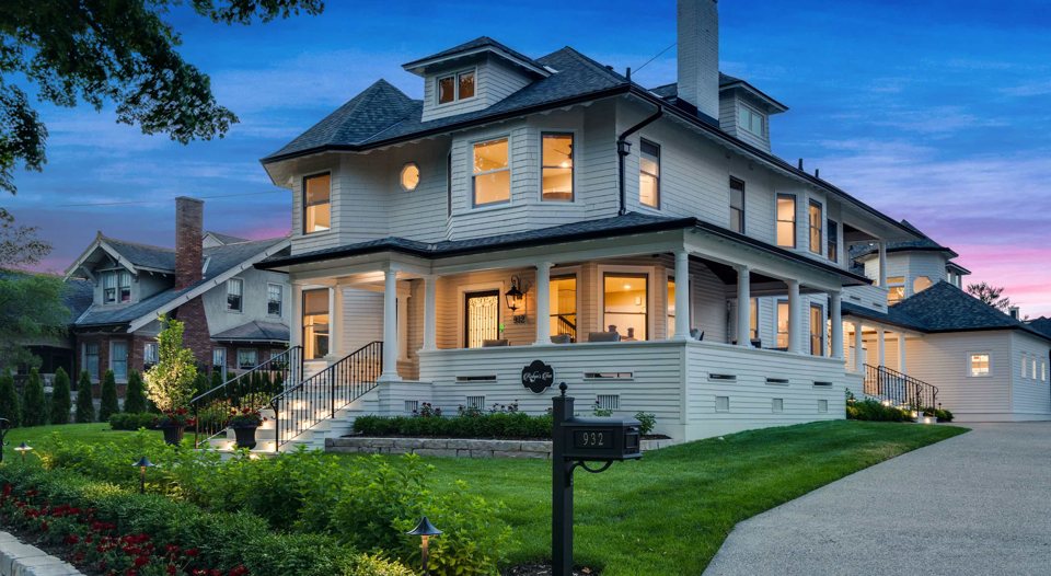 The lit Victorian-style inn at dusk