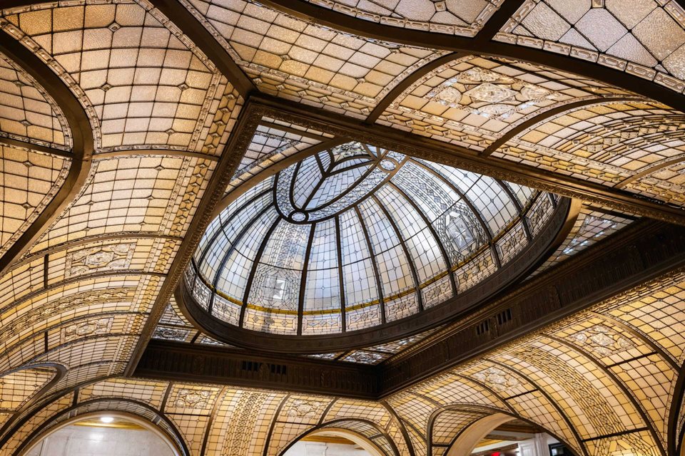 The leaded-glass dome and vaulted glass ceiling of the Book Tower rotunda