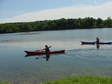 Kayakers on the campground lake