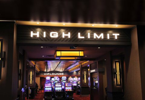 The lit entrance of the casino's High Limit room with slot machines