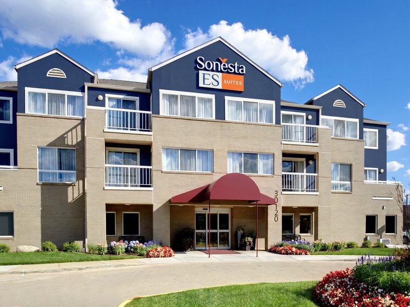 The hotel's three-storey facade with an entrance canopy