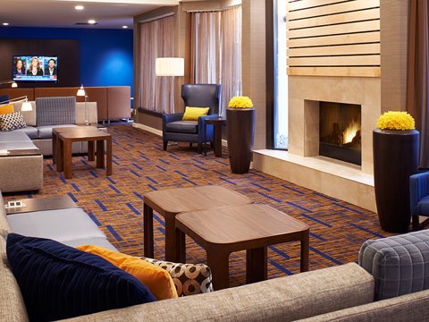 Lounge with a fireplace and armchairs