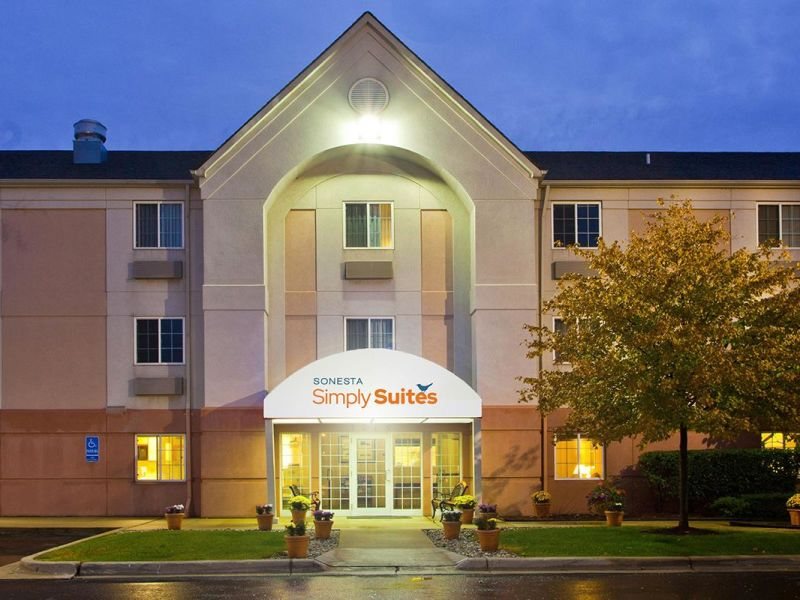 The hotel's brick facade with a lit entrance