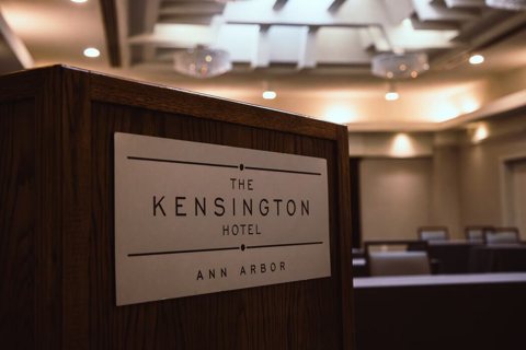 The hotel's name plate on a dark wood lectern in the meeting room