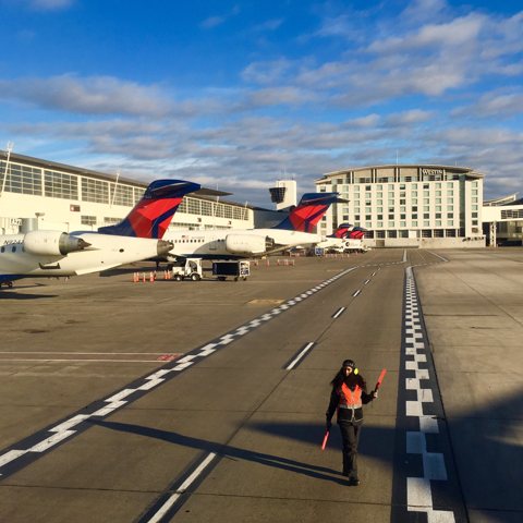 McNamara Terminal Concourse A and the Westin hotel seen from the apron, with aircraft