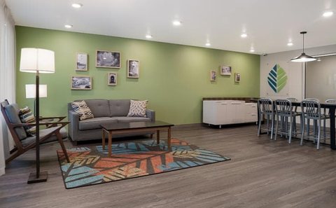 Lounge with sofas and a kitchen area