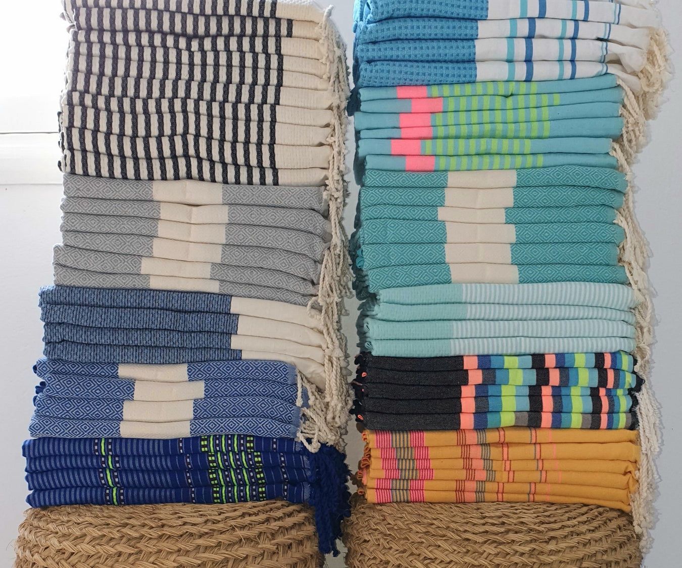 Tall stacks of colorful striped cotton fouta towels