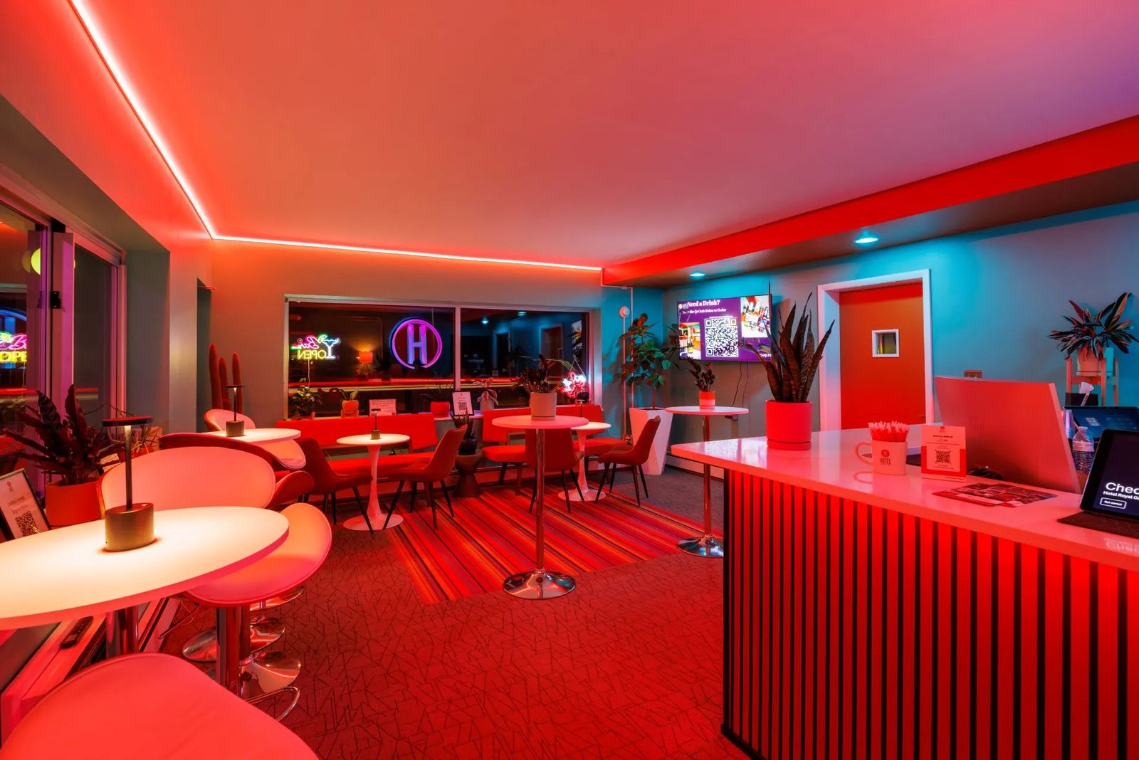 Red neon-lit lounge in the Hotel Royal Oak lobby