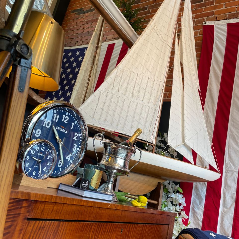 Model sailboat, blue-faced clocks and an American flag among home decor items