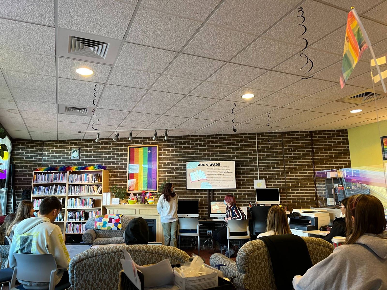 The center's lounge with sofas, bookshelves and students gathering