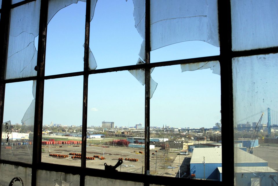 The rail yards and Ambassador Bridge through a broken window, 2012