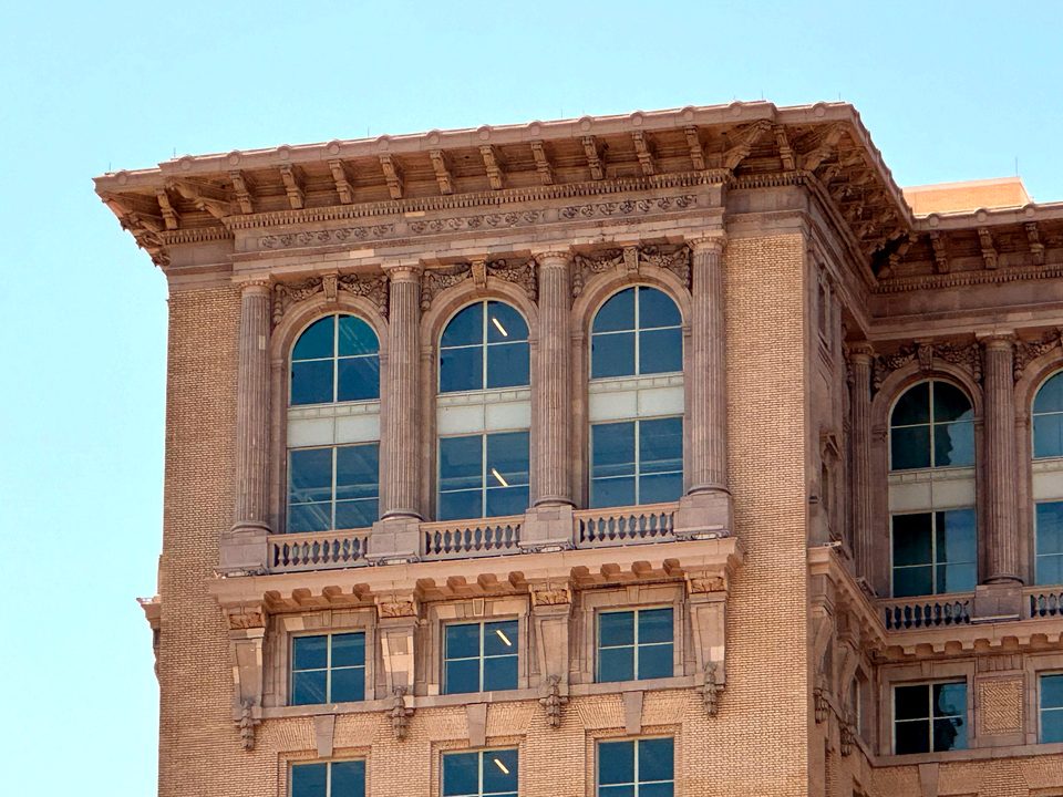 The tower corner with restored windows and cornice, 2024