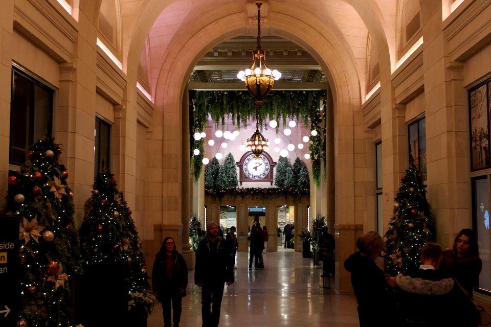 The arcade decked out with Christmas trees and the clock at the end, 2025