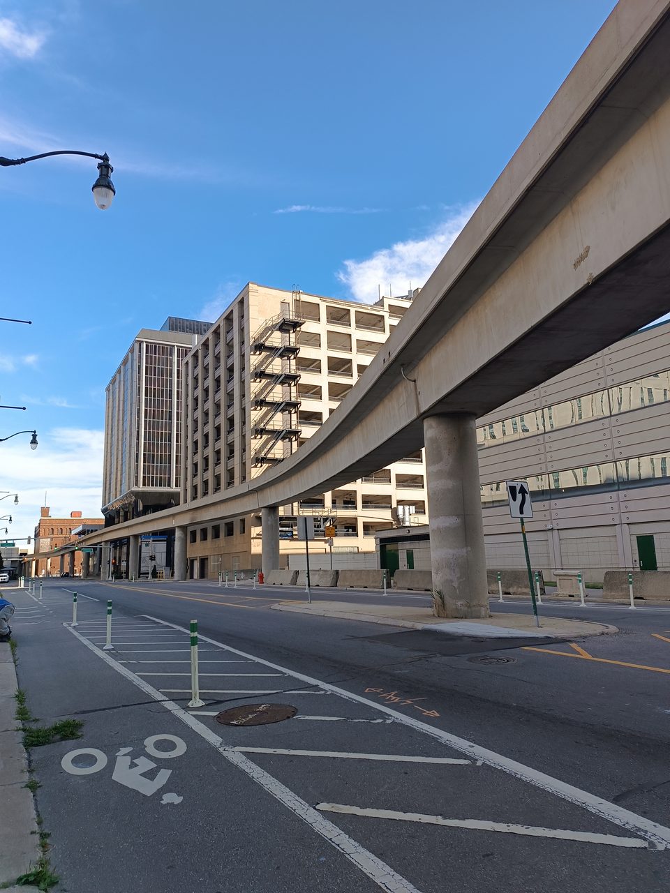 The concrete guideway from below, above a bike lane (2024)
