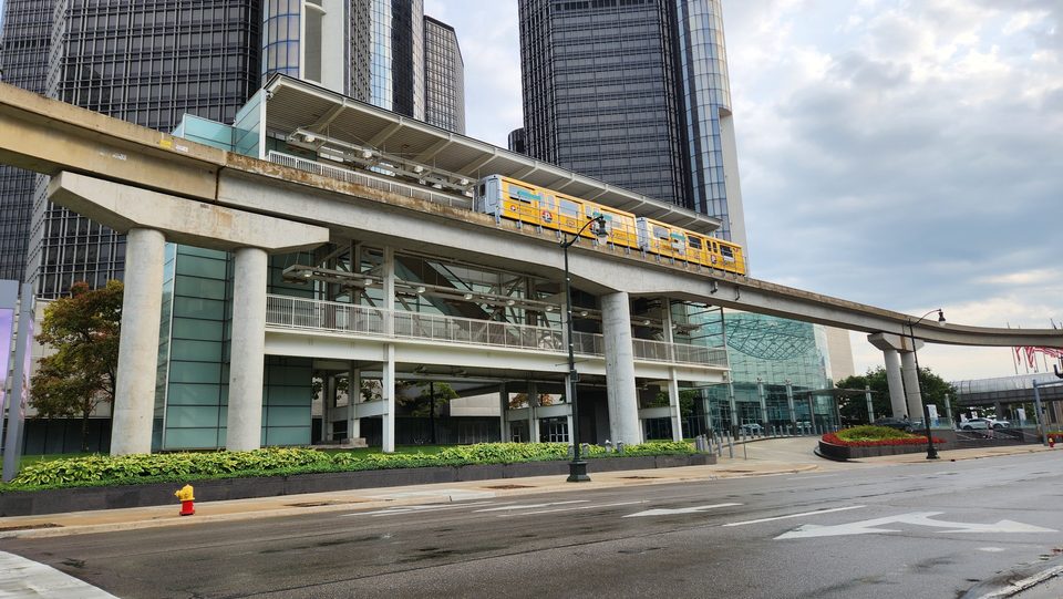 Renaissance Center station at the foot of the towers, with a train arriving (2025)