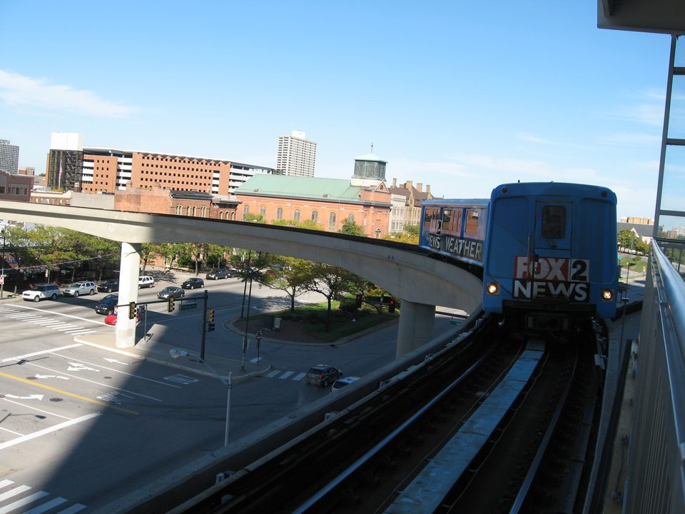 An advertising-wrapped train on a curve of the guideway (2008)