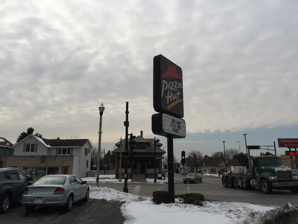 A Pizza Hut pole sign left standing after the restaurant was torn down, Wisconsin, 2015