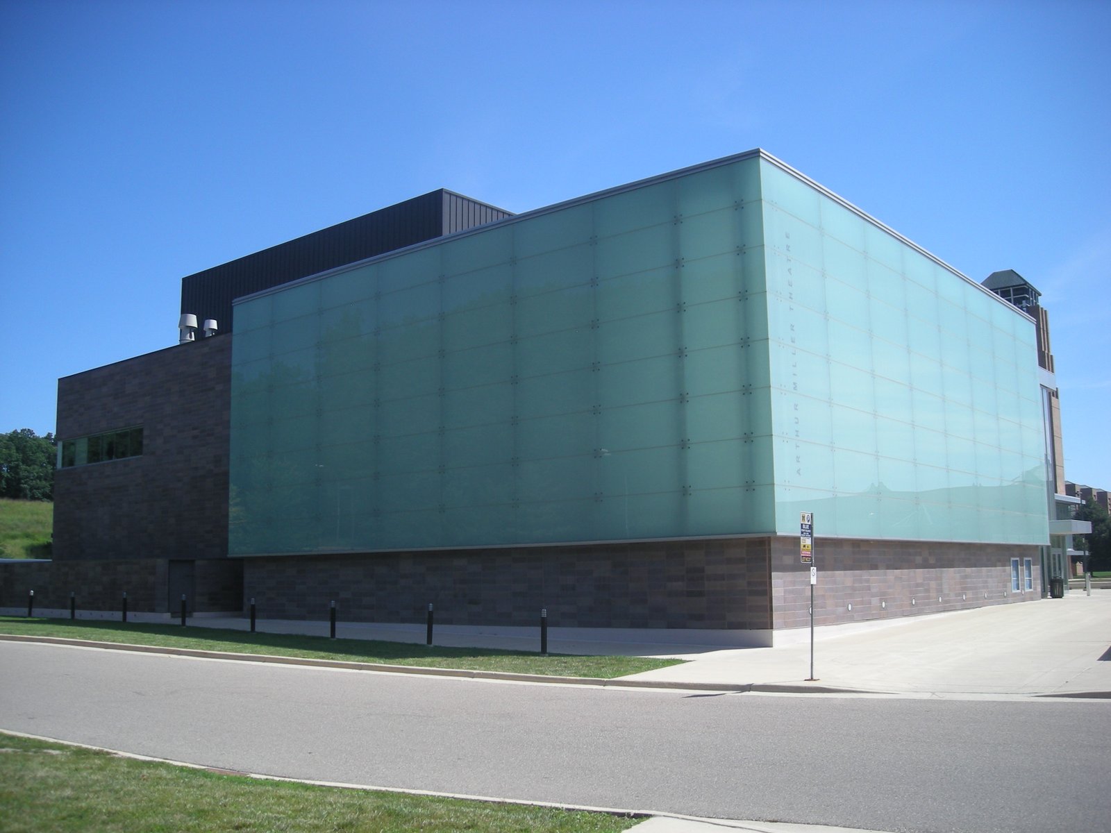 The Walgreen Drama Center on North Campus, a brick building with a large green glass block; the Arthur Miller Theatre is inside