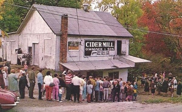 Vintage photo of a crowd outside the white mill signed O. Wagner & Son