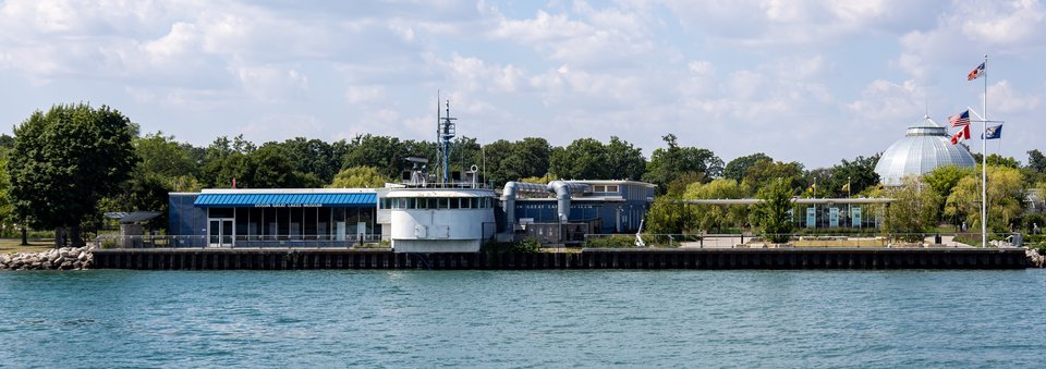 The museum and the William Clay Ford pilothouse seen from the Detroit River
