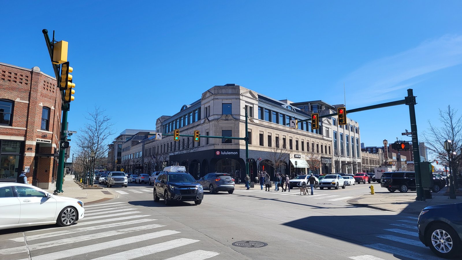 An intersection in downtown Birmingham lined with brick and stone storefronts