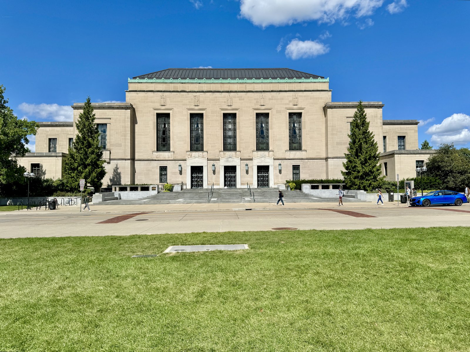 The Rackham Building's limestone facade and front steps from East Washington Street, September 2024