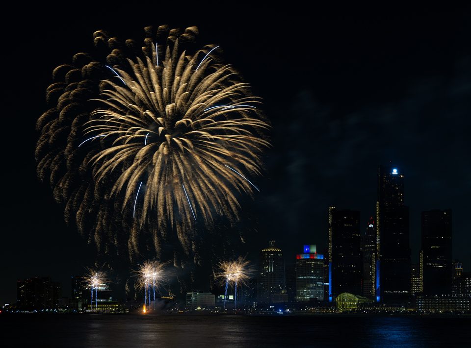 Golden bursts over the river at the 2025 Ford Fireworks