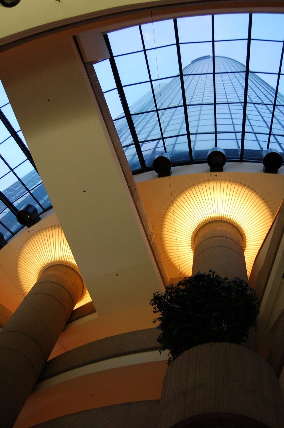 Looking up from the GM showroom floor: lit column tops and the hotel cylinder through the skylight (January 2008)