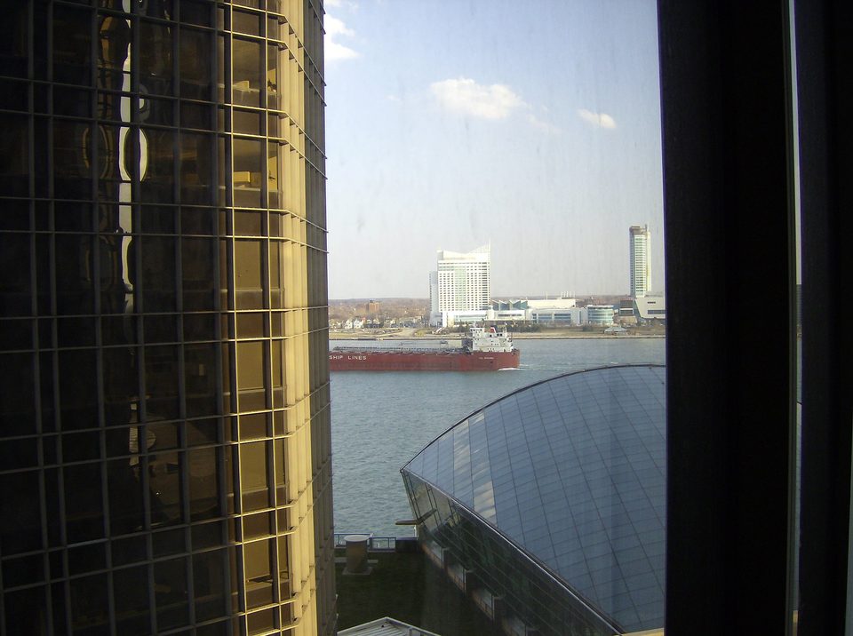 The view from an 11th-floor hotel room: the Wintergarden’s glass roof below, the freighter CSL Niagara passing on the river and Windsor beyond (2008)
