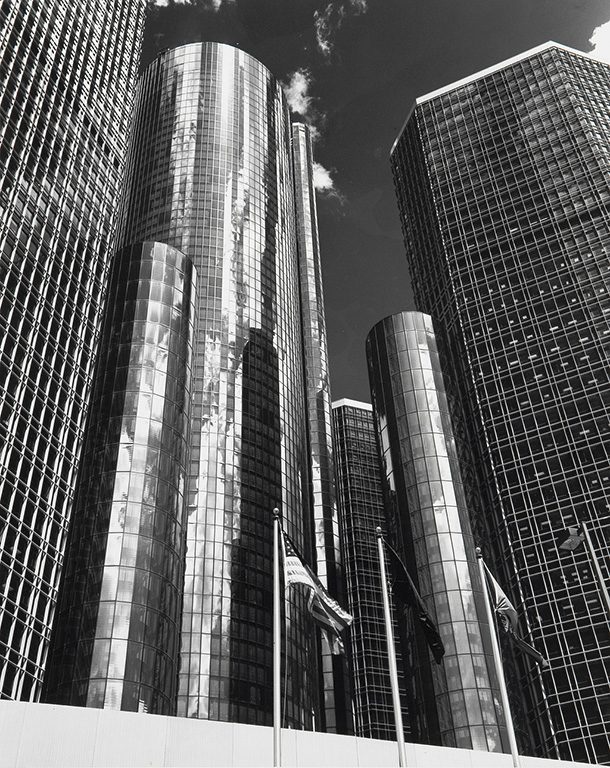 A black-and-white view up the cylindrical glass towers, flags in front, from Budapest-born Balthazar Korab’s archive
