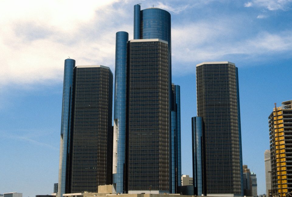 The Renaissance Center towers in July 1980, during the Republican National Convention, with a building going up on the right