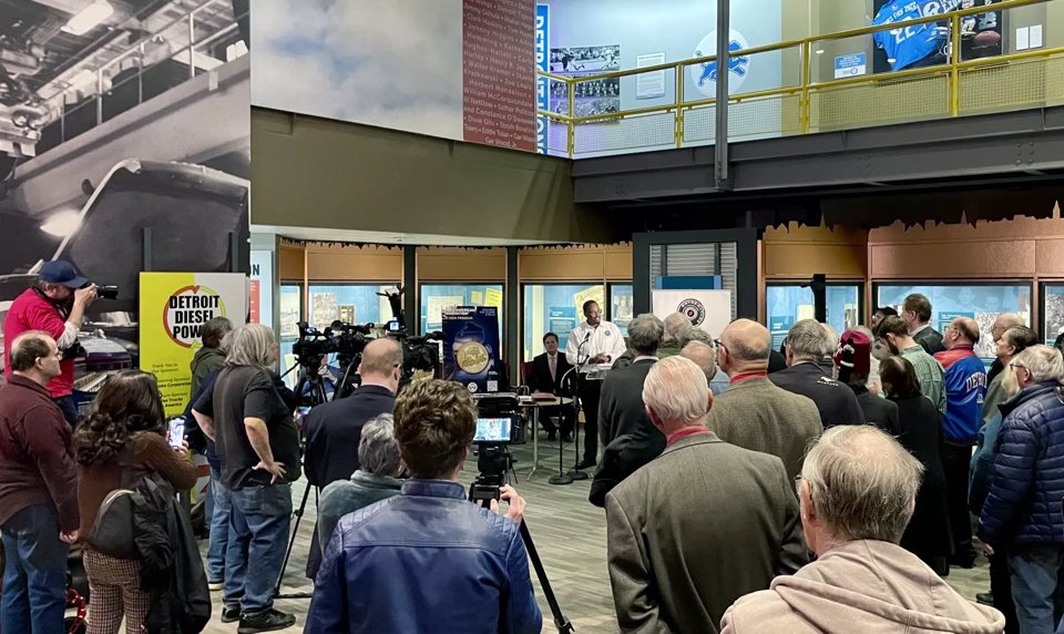 A crowd of visitors at a museum exhibit