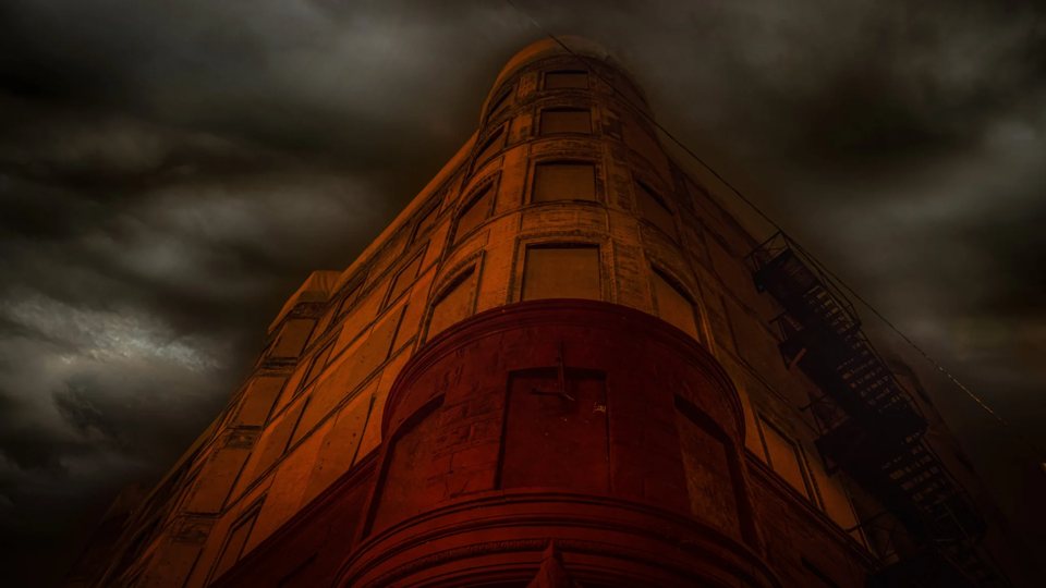 The Alhambra Building in Detroit, dramatically lit in red at night
